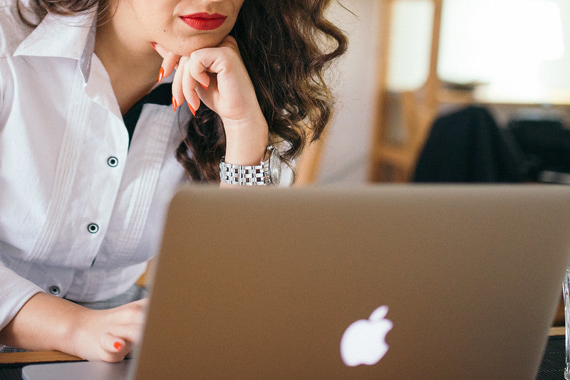 woman attending hybrid summer outing online
