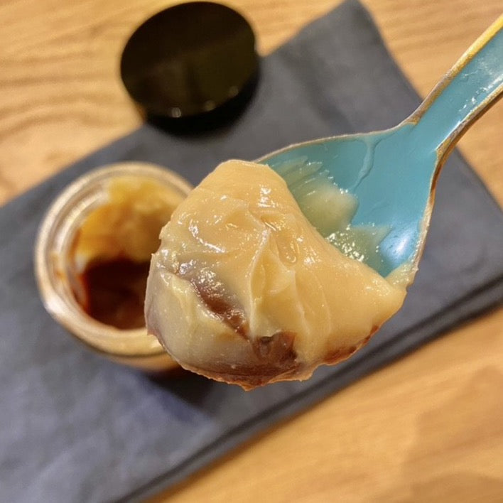 Passion fruit and dark chocolate Brigadeiro in a spoon