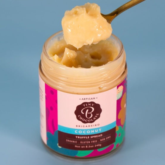 spooning coconut brigadeiro from the jar