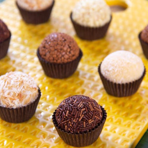 Collection of tropical fruit and chocolate brigadeiros